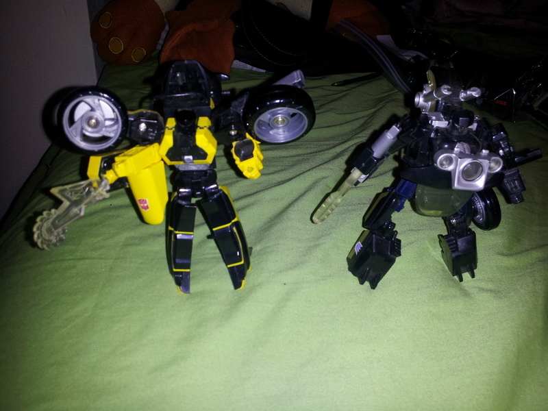 Transformers Sideways vs. Axer Robots In Disguise