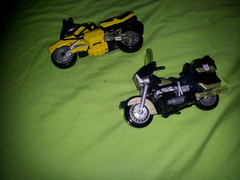 Transformers Sideways vs. Axer Robots In Disguise